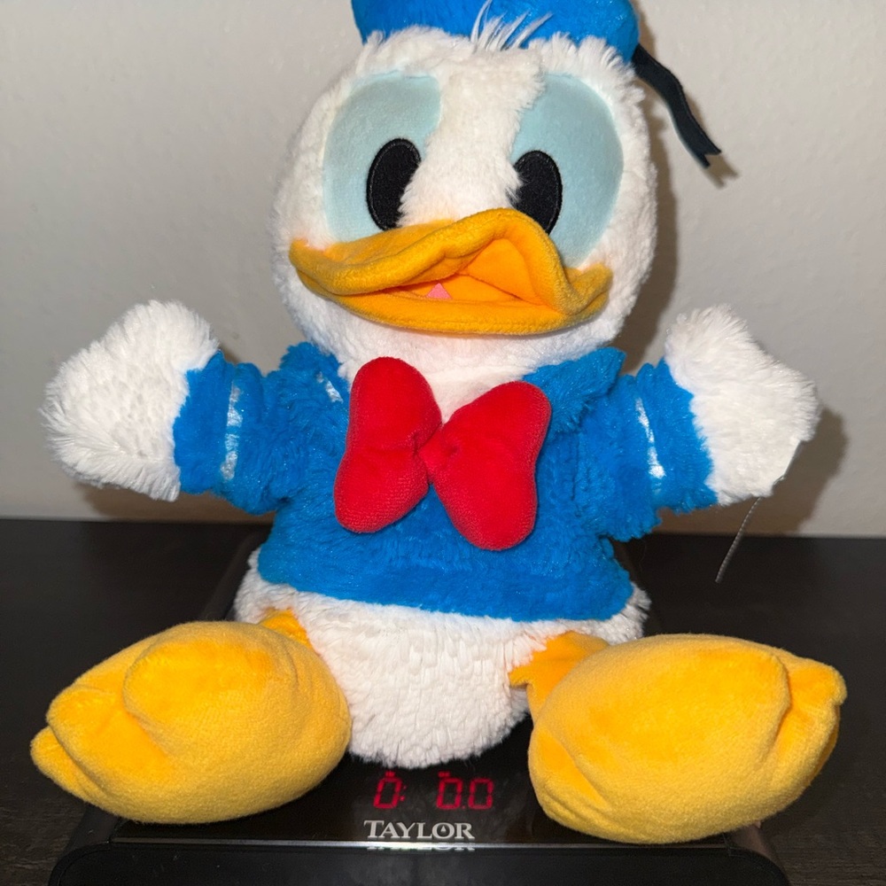 Disney Donald Duck hand puppet White, Blue and Yellow with Red Bow